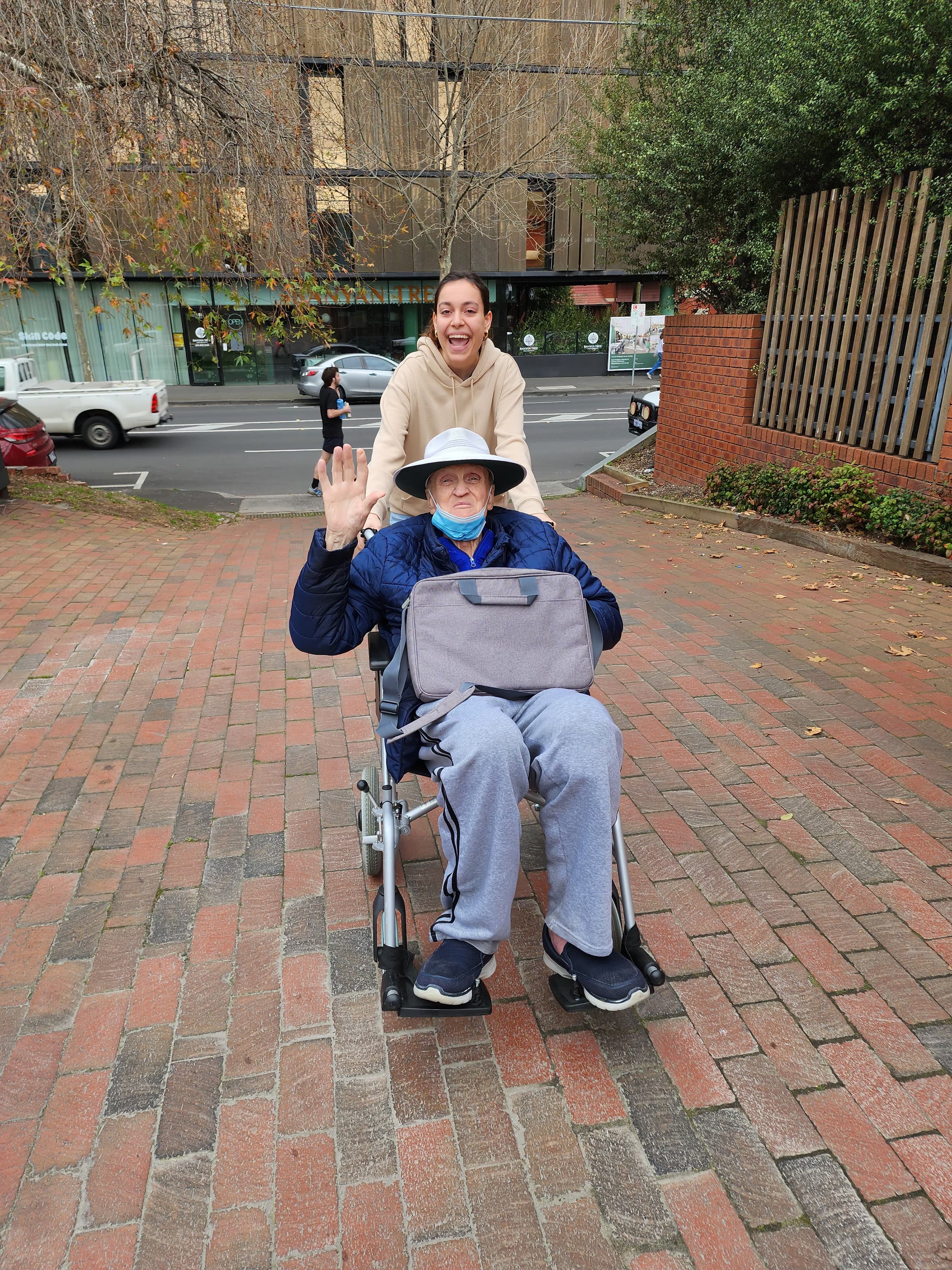 Resident and carer out for a walk together