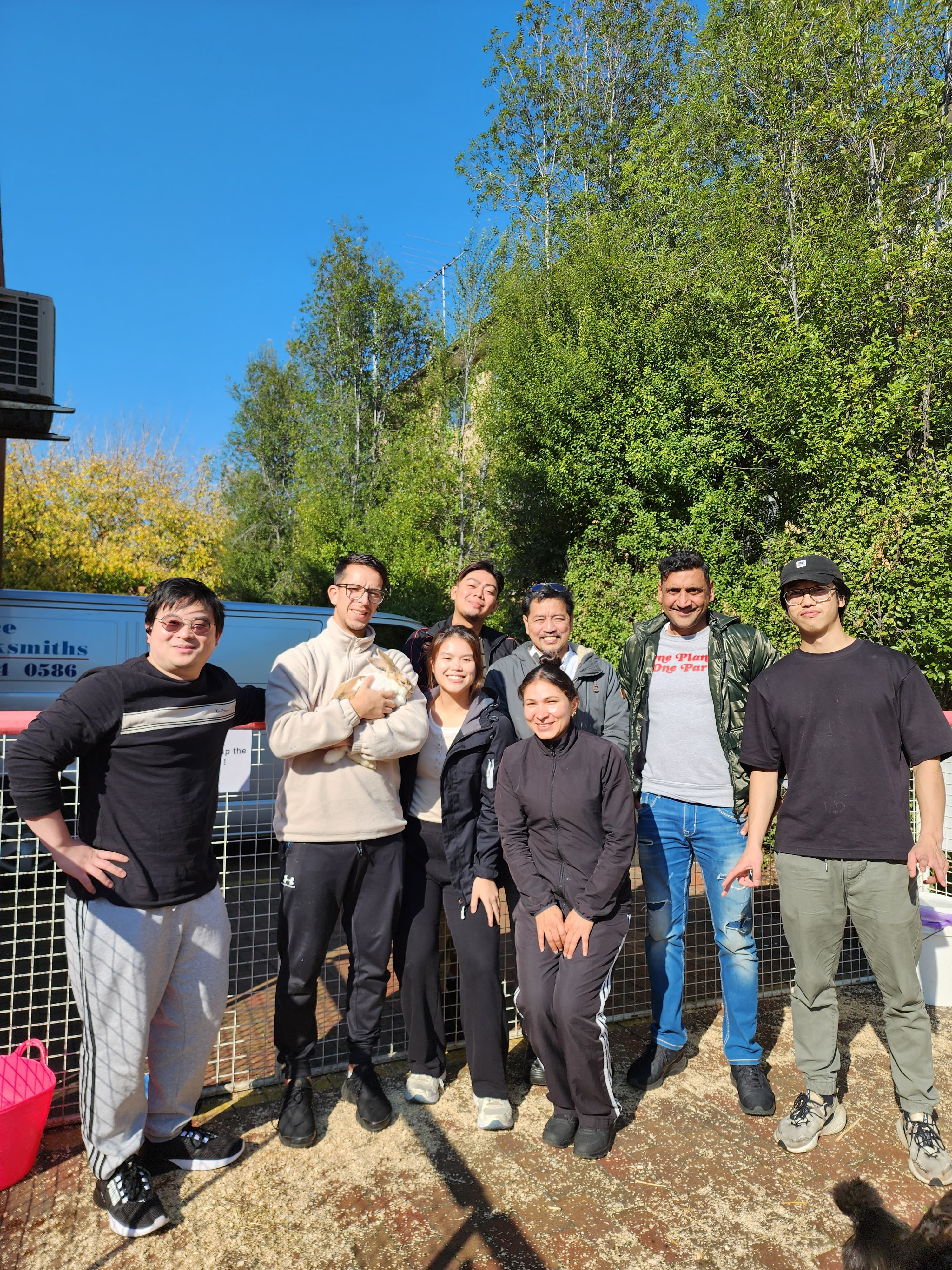 Staff and residents group photo outdoors