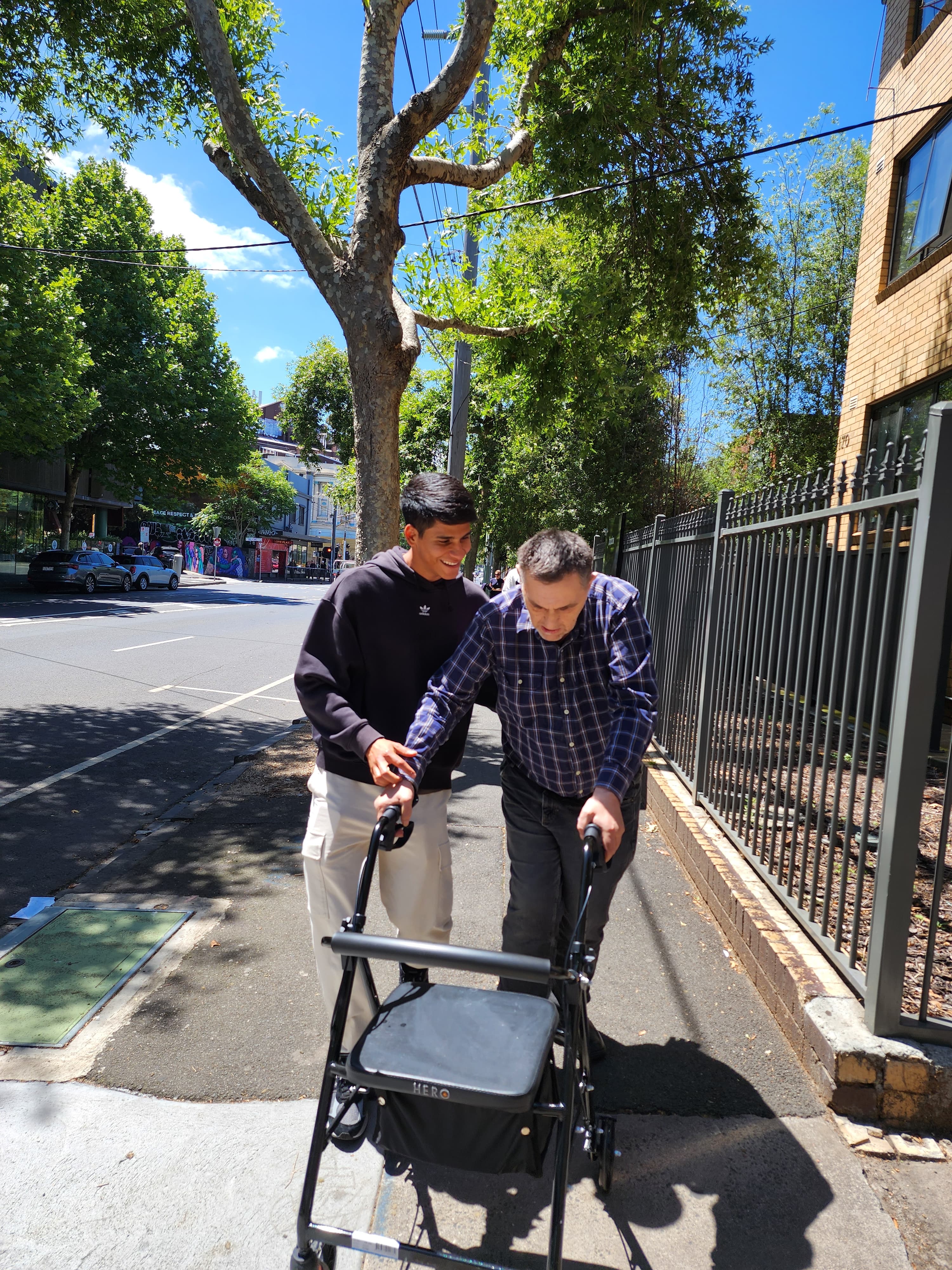 Resident and carer out for a walk in the neighbourhood