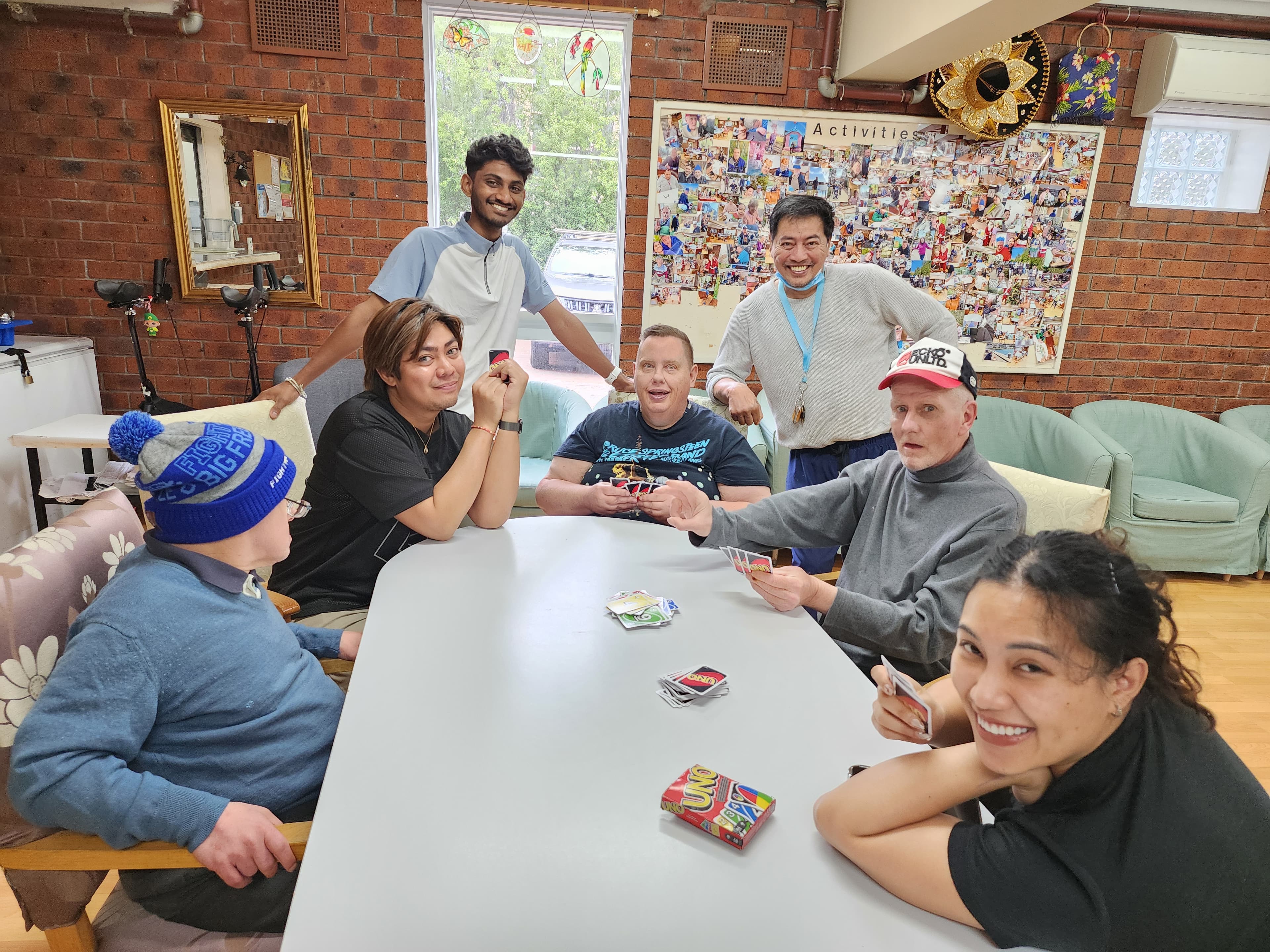Residents and staff enjoying a game of UNO