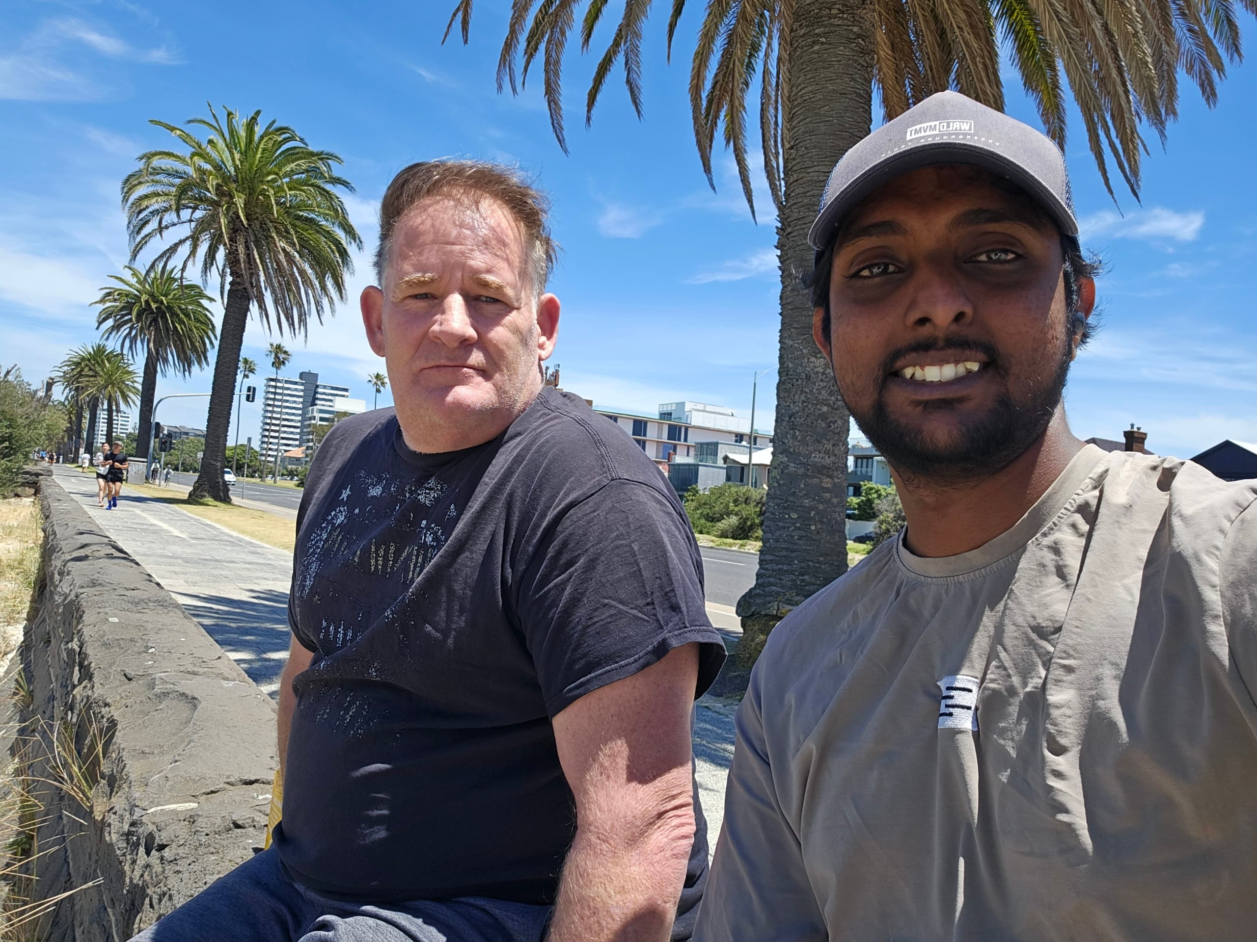 Resident and carer at the St Kilda foreshore