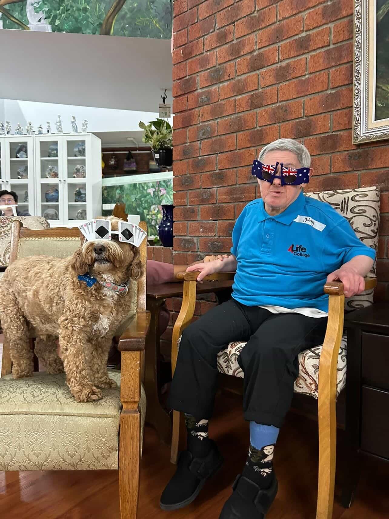 Resident and therapy dog dressed up for Australia Day