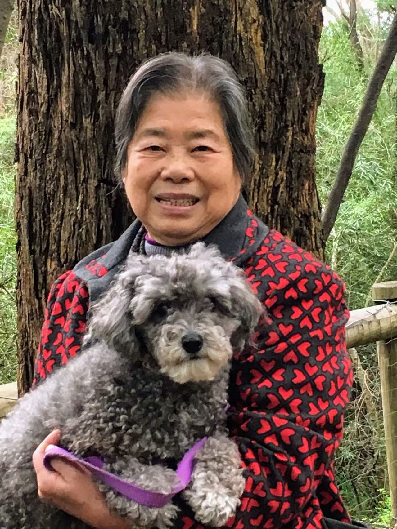 Resident with a pet dog outdoors